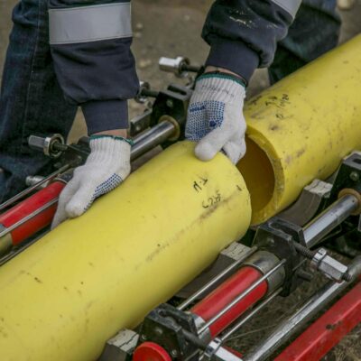 A Person Holding Yellow Pipes